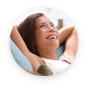 Woman sitting back in dental chair and relaxing